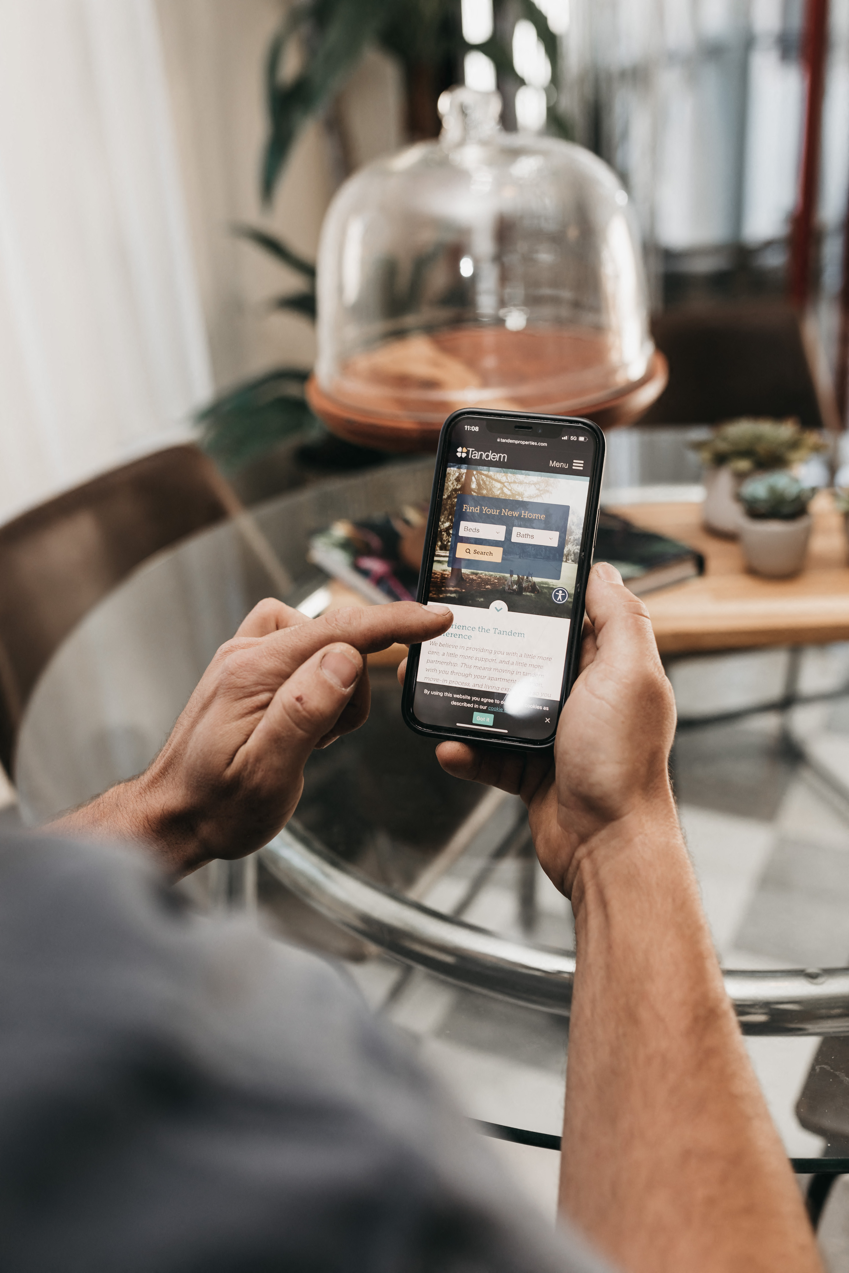 Young man out of frame holding phone